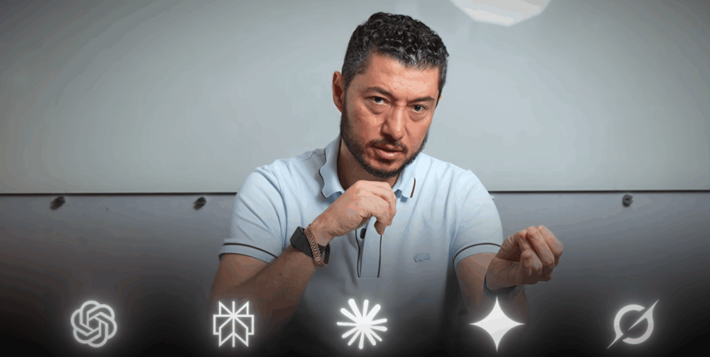 Claude Code Changed How I Run My Entire Business | Digital Marketing and eCommerce Development Company Man with short dark hair and beard in a light blue polo speaks and gestures toward the camera, with glowing icons along the bottom edge.