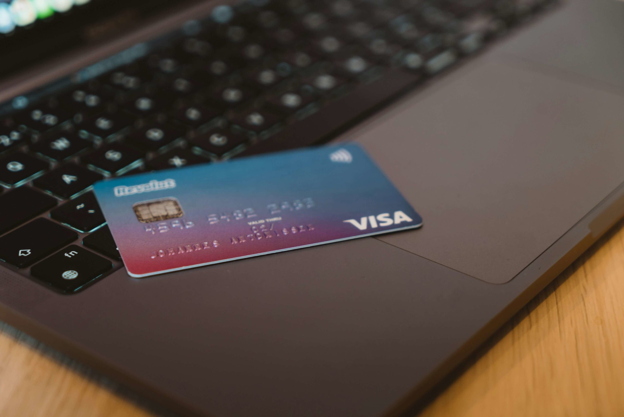 credit-card-on-laptop-keyboard | Digital Marketing and eCommerce Development Company Credit card placed on a laptop keyboard, representing digital payments, online banking, and secure eCommerce transactions.