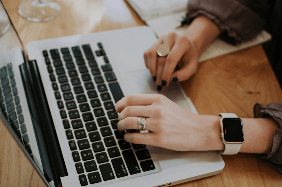 Developer working on laptop researching technology solutions