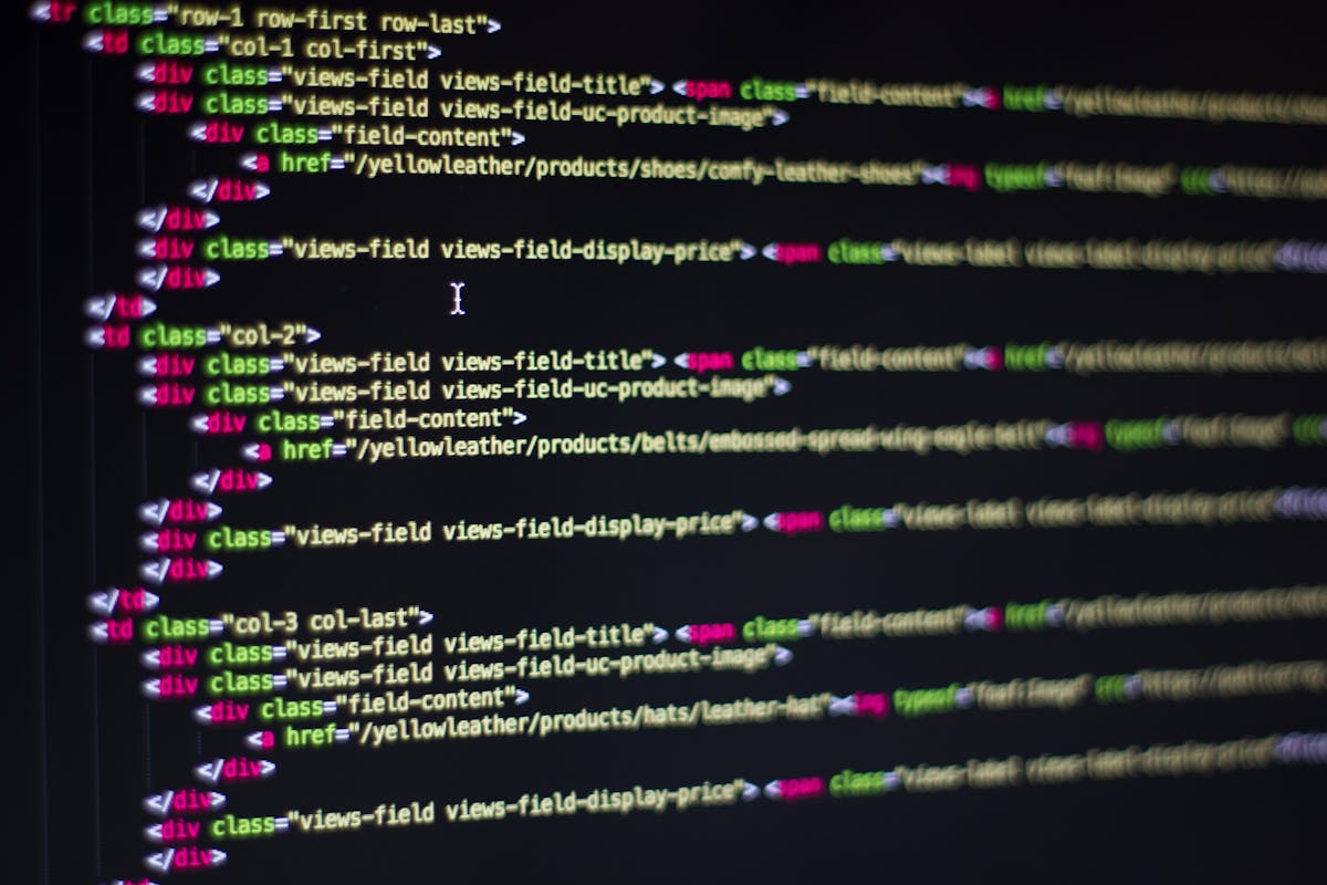 Close-up of colorful HTML and CSS code displayed on a developer's monitor