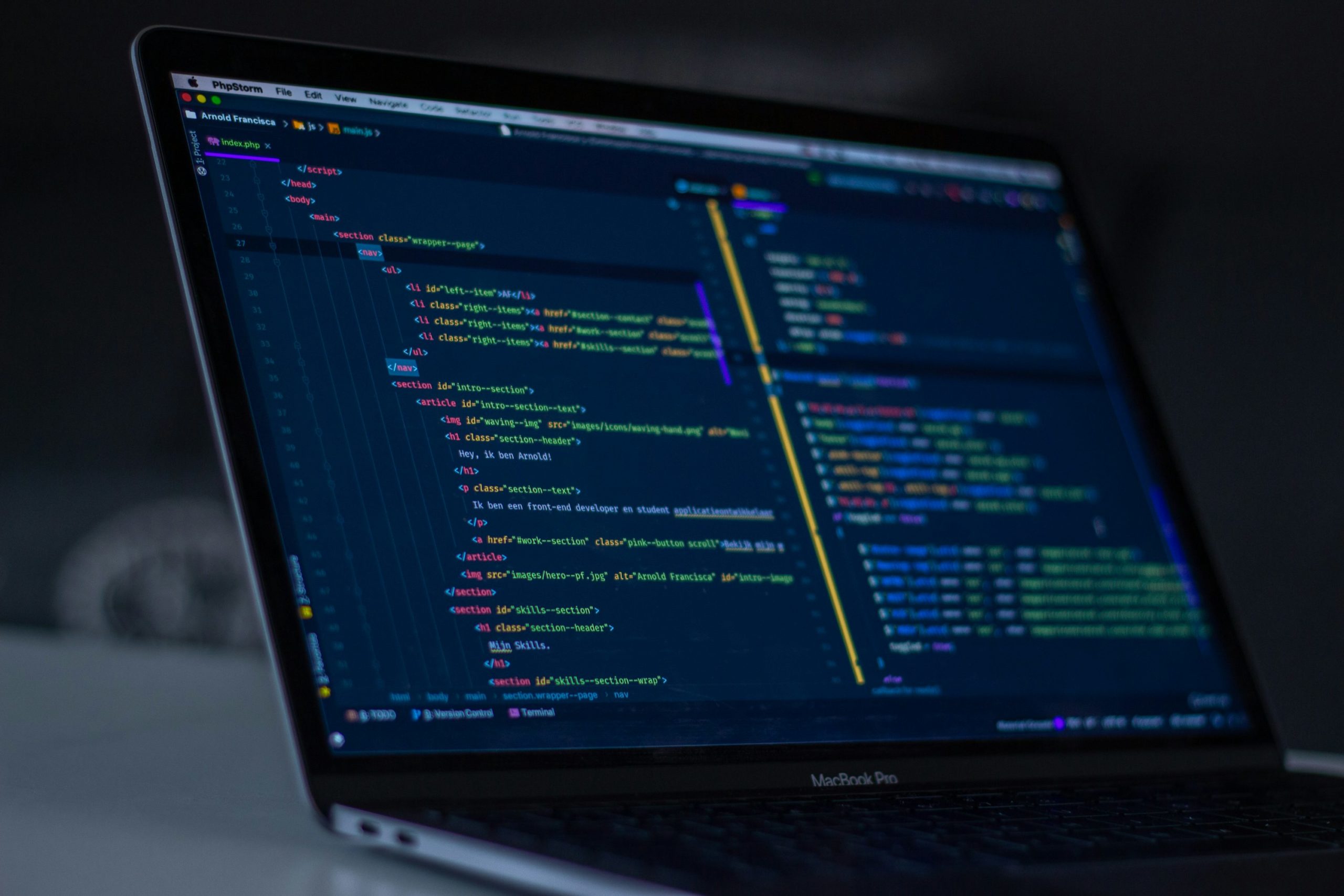 Developer reviewing ecommerce platform code in a dark code editor during a site migration project