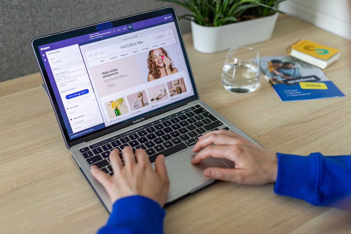 Developer building a custom ecommerce frontend on a laptop