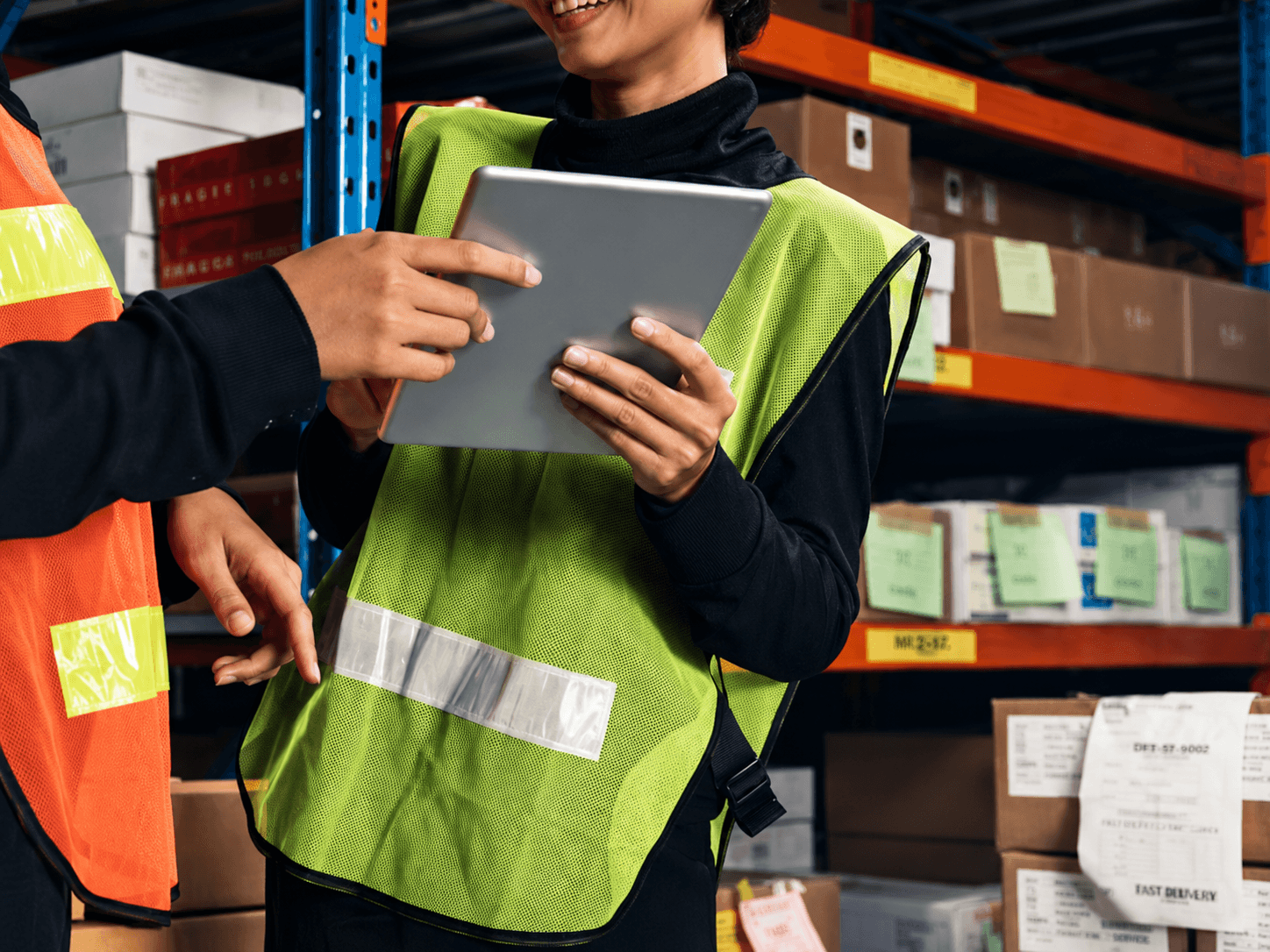 Warehouse worker using tablet for inventory management